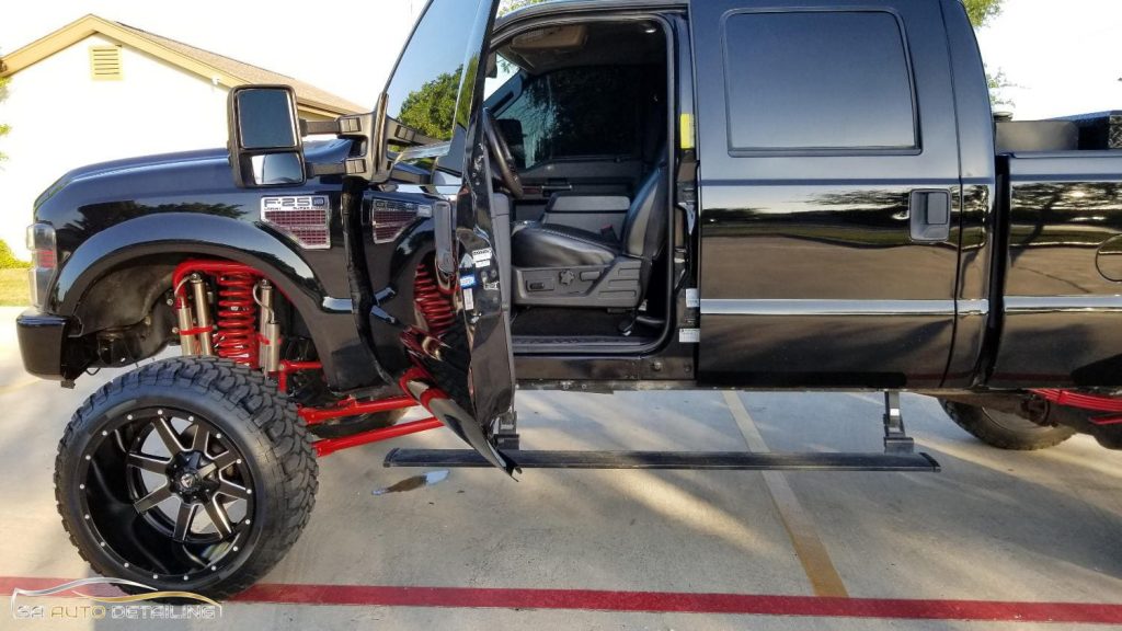 F-250 Lifted Truck with Front Door Open