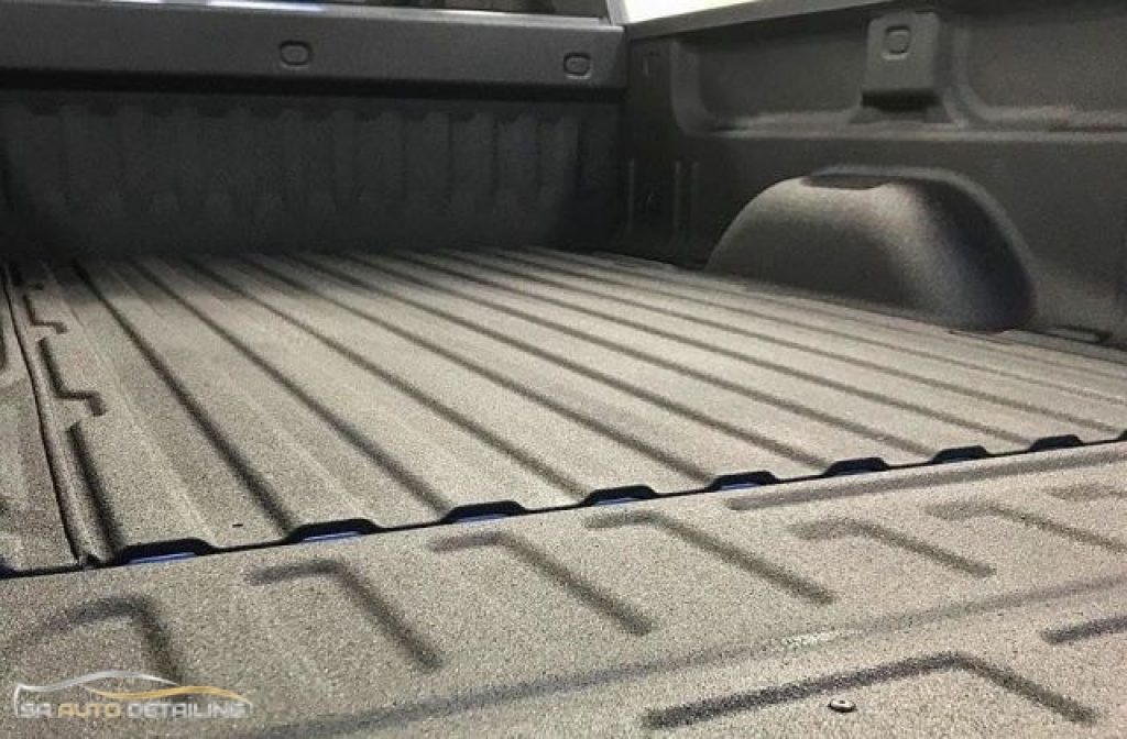 The back of a truck with spray in bed liner